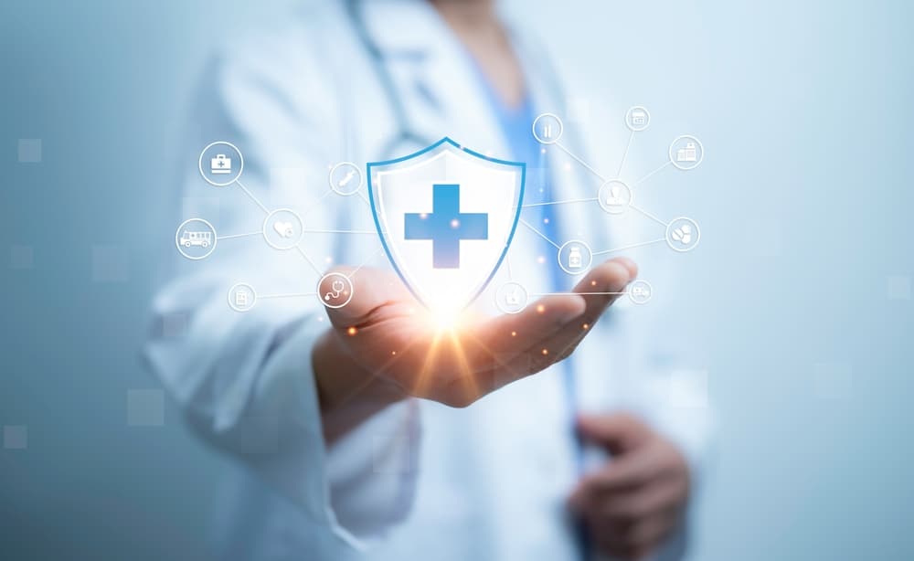 A medical worker holding of health care icons