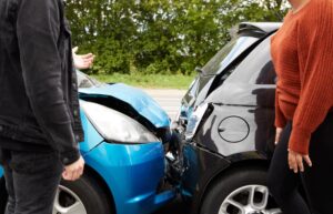 Two angry drivers arguing over who is at fault for a car accident.